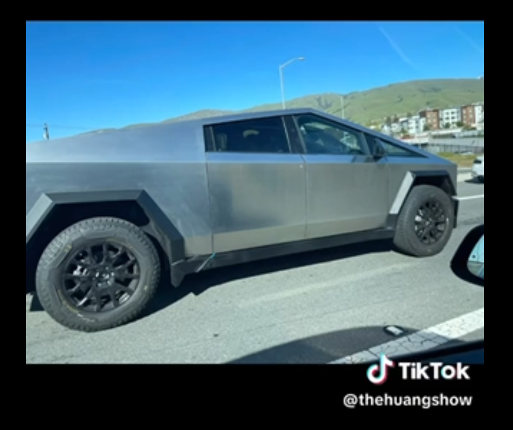 Tesla Cybertruck Cybertruck spotted driving next to Chevy Silverado! 1682457839555