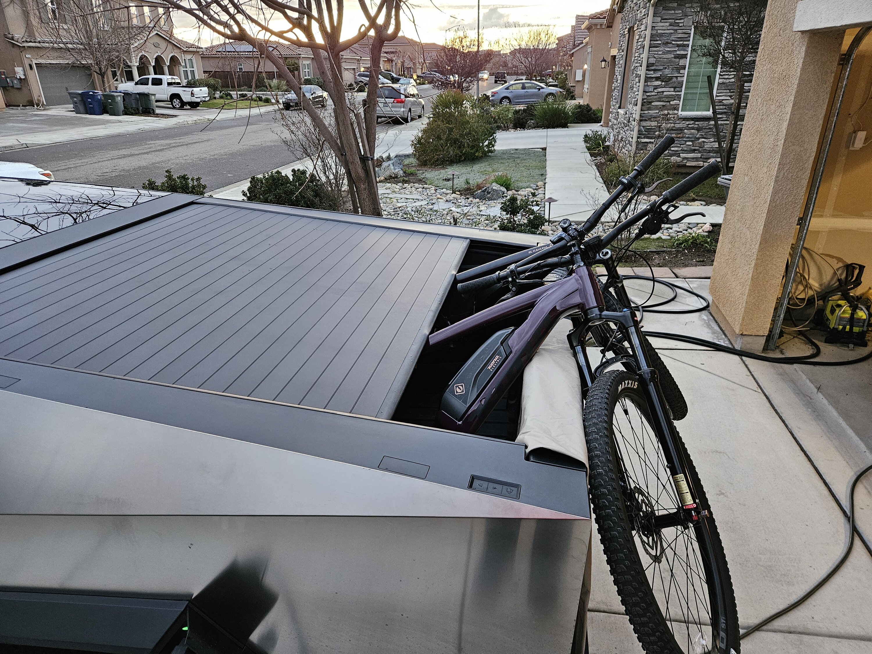 Tesla Cybertruck Anyone transport e-bikes in bed vs on rack/hitch in their CT? 20240202_173155