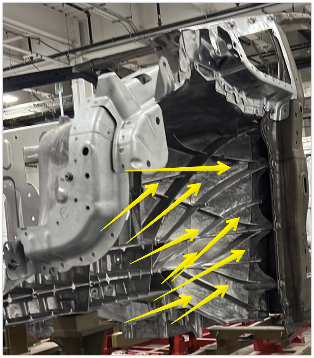 Tesla Cybertruck New Body-in-White pic shows front wheel well, front quarter window + more debris tra
