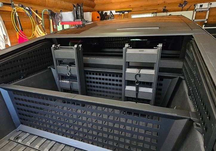 Storing Tesla Tailgate Ramps in Cybertruck bed strapped to cargo